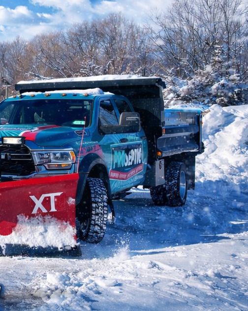 Patriot Pottys plow truck clearing snow